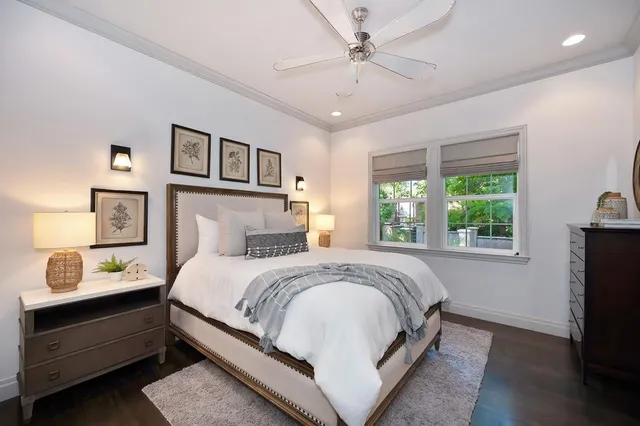 a view of a patio with table and chairs and potted plants