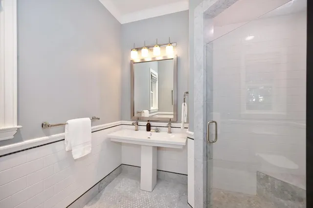 a view of a patio with table and chairs and potted plants