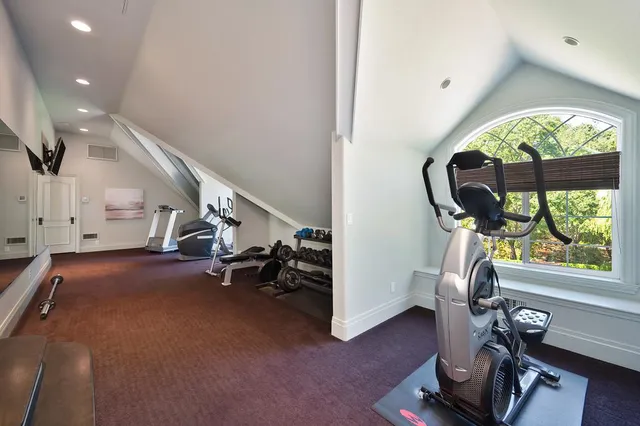 an aerial view of a house with a yard and garden