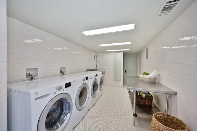 an aerial view of a house with outdoor space and a lake view