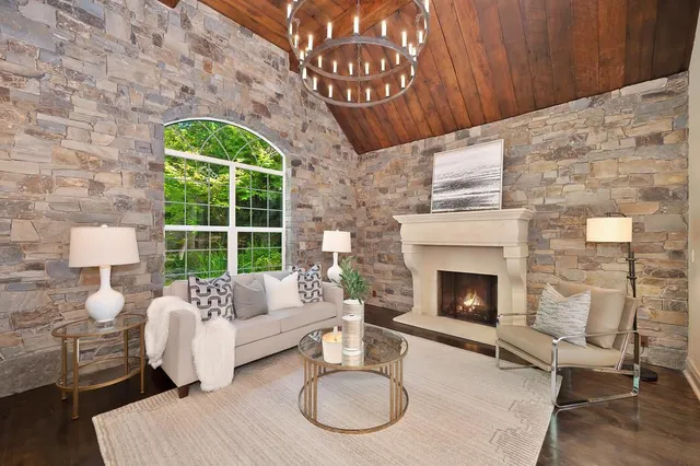 a dining room with furniture a livingroom and chandelier