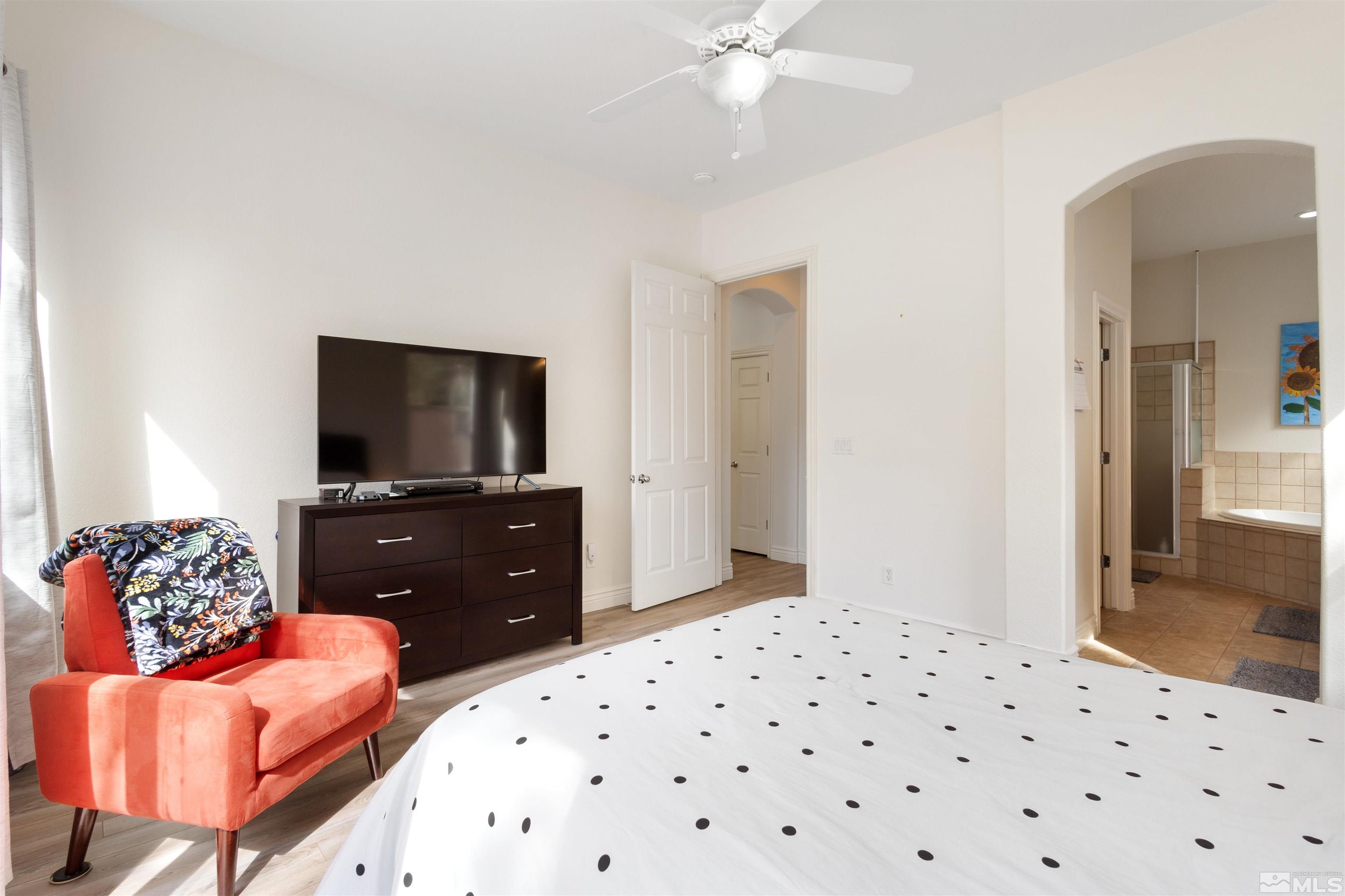 10521 Fort Morgan Way Reno, NV 89521 - Photo 20 of 35 a bedroom with a bed and a flat screen tv