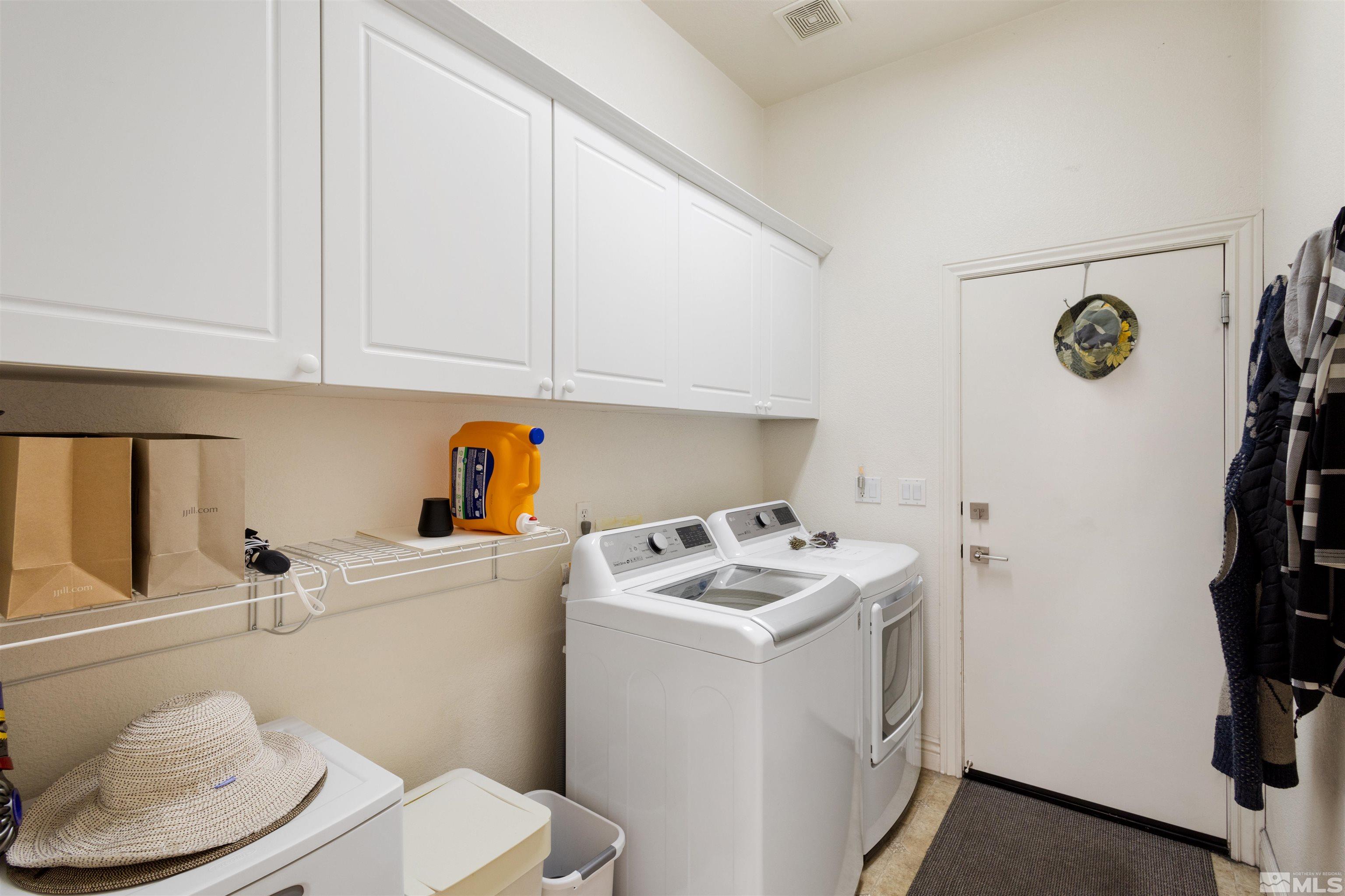10521 Fort Morgan Way Reno, NV 89521 - Photo 29 of 35 a utility room with dryer and washer