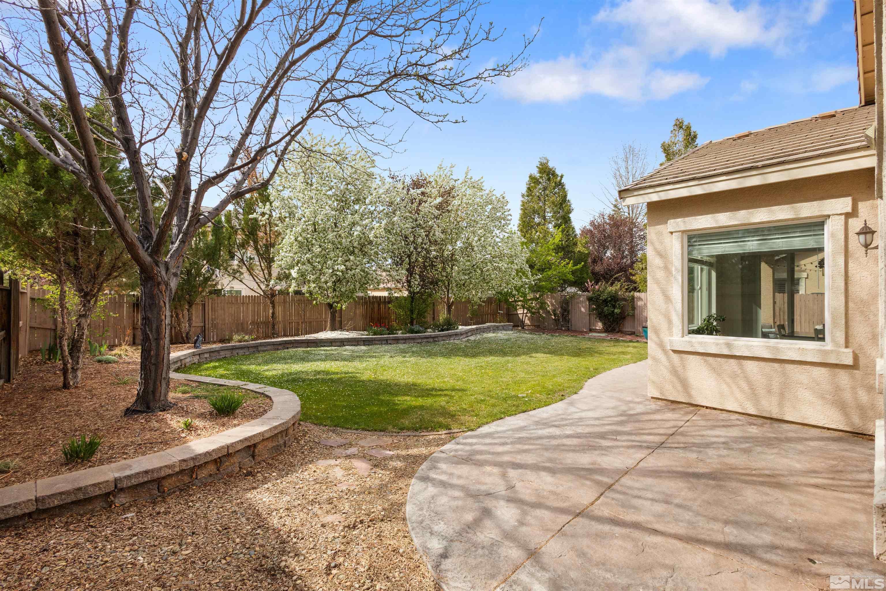 10521 Fort Morgan Way Reno, NV 89521 - Photo 33 of 35 a view of a house with a yard