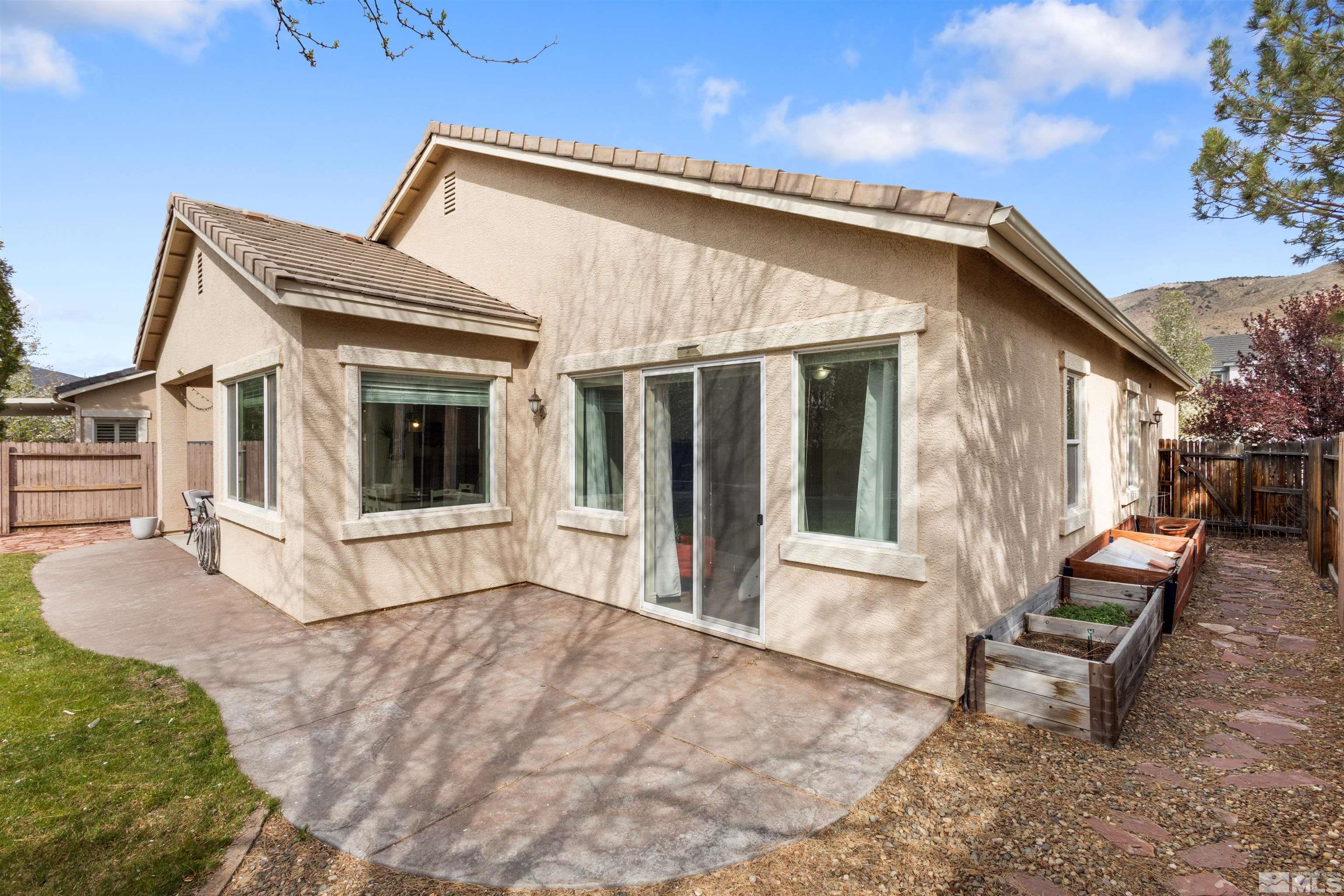 10521 Fort Morgan Way Reno, NV 89521 - Photo 34 of 35 a view of a house with backyard and sitting area