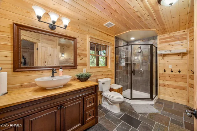 a view of a kitchen with refrigerator and windows