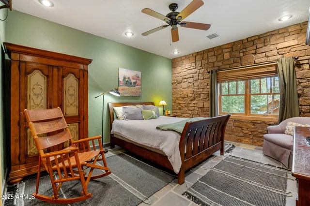a bedroom with furniture and a wooden floor