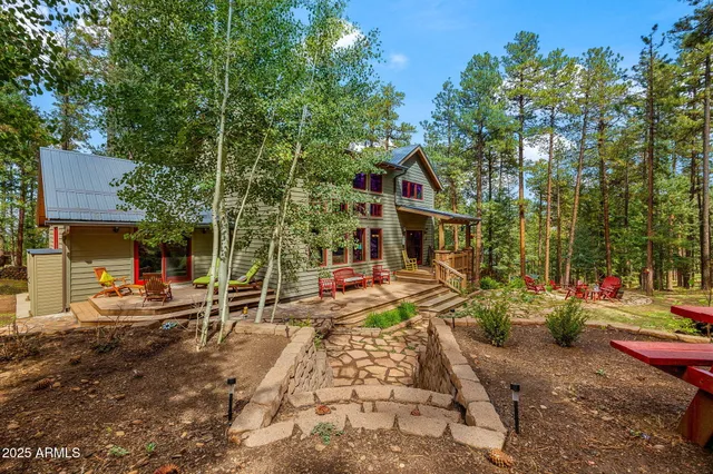 a front view of a house with sitting area