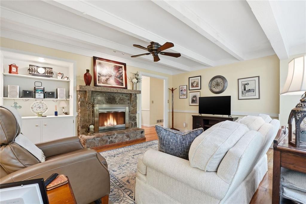 1837 Chancery Lane Atlanta, GA 30341 - Photo 18 of 46 a living room with furniture a flat screen tv and a fireplace