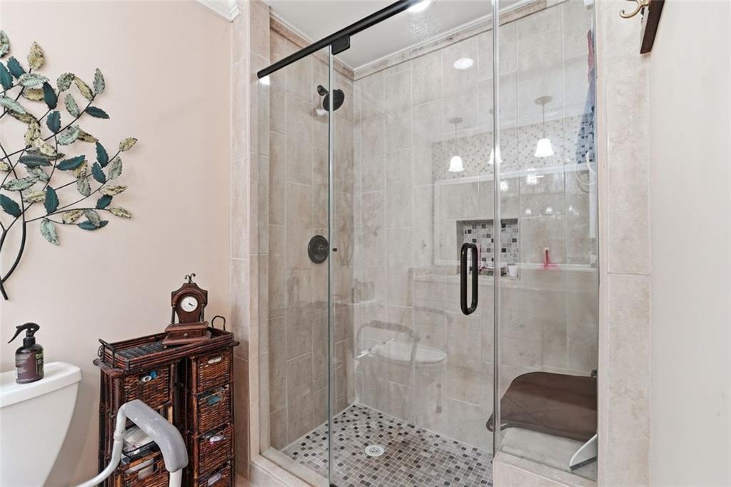 1837 Chancery Lane Atlanta, GA 30341 - Photo 26 of 46 a bathroom with a bathtub and shower