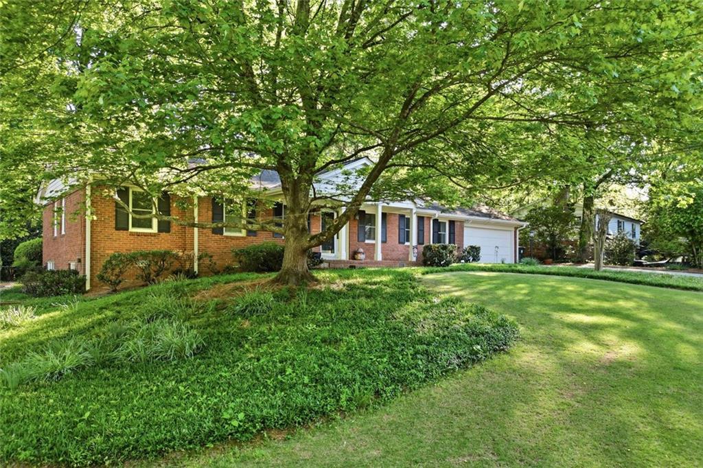 1837 Chancery Lane Atlanta, GA 30341 - Photo 3 of 46 a front view of a house with a garden