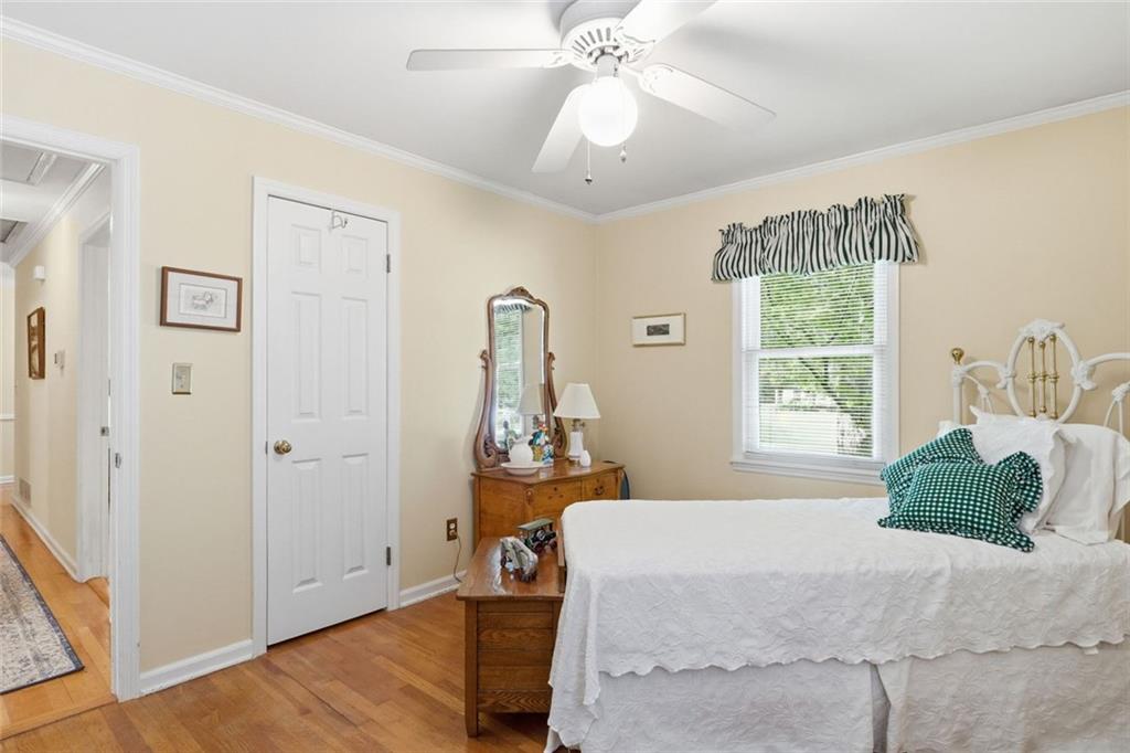 1837 Chancery Lane Atlanta, GA 30341 - Photo 32 of 46 a bedroom with a bed and a chandelier