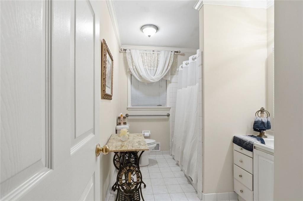 1837 Chancery Lane Atlanta, GA 30341 - Photo 35 of 46 a bathroom with a mirror and a sink