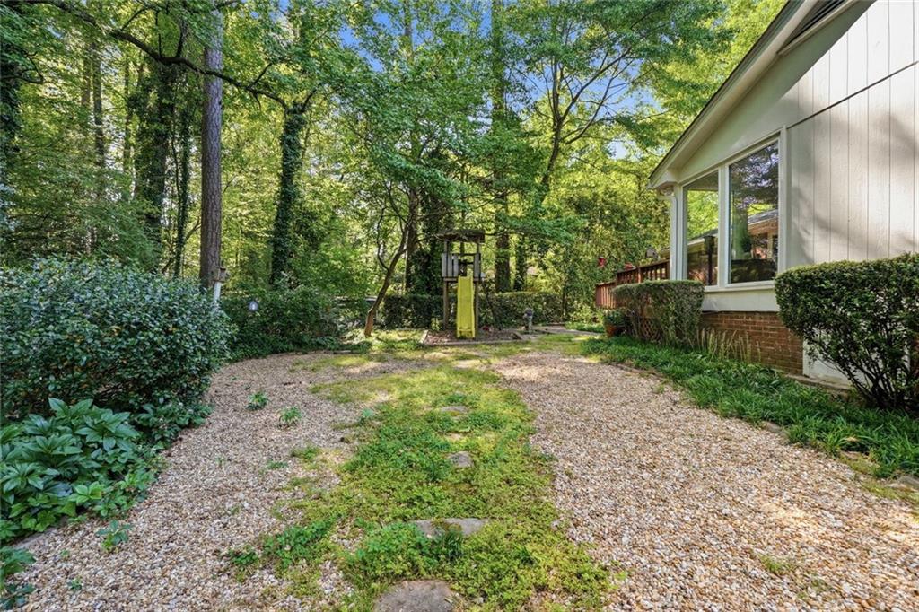 1837 Chancery Lane Atlanta, GA 30341 - Photo 38 of 46 a view of a yard with plants and large trees
