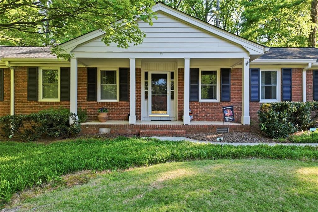 1837 Chancery Lane Atlanta, GA 30341 - Photo 4 of 46 a front view of a house with a yard and porch