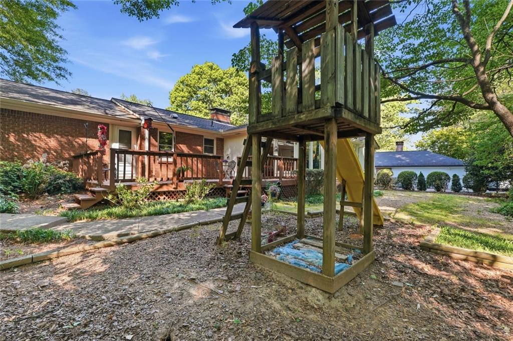 1837 Chancery Lane Atlanta, GA 30341 - Photo 42 of 46 a view of a chairs and table in the backyard