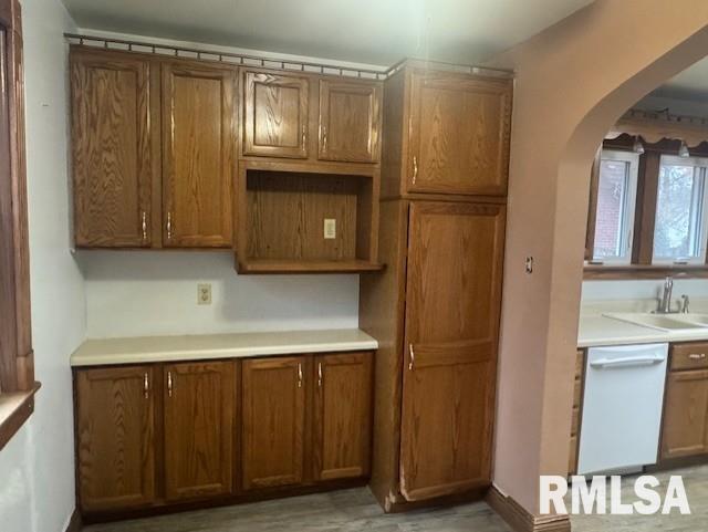 1013 North 2nd Street Clinton, IA 52732 - Photo 5 of 14 a kitchen with a refrigerator and cabinets