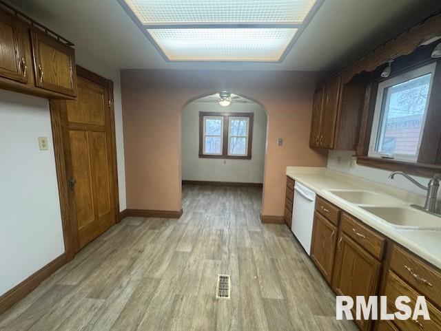 1013 North 2nd Street Clinton, IA 52732 - Photo 7 of 14 a view of a kitchen with a sink and wooden floor