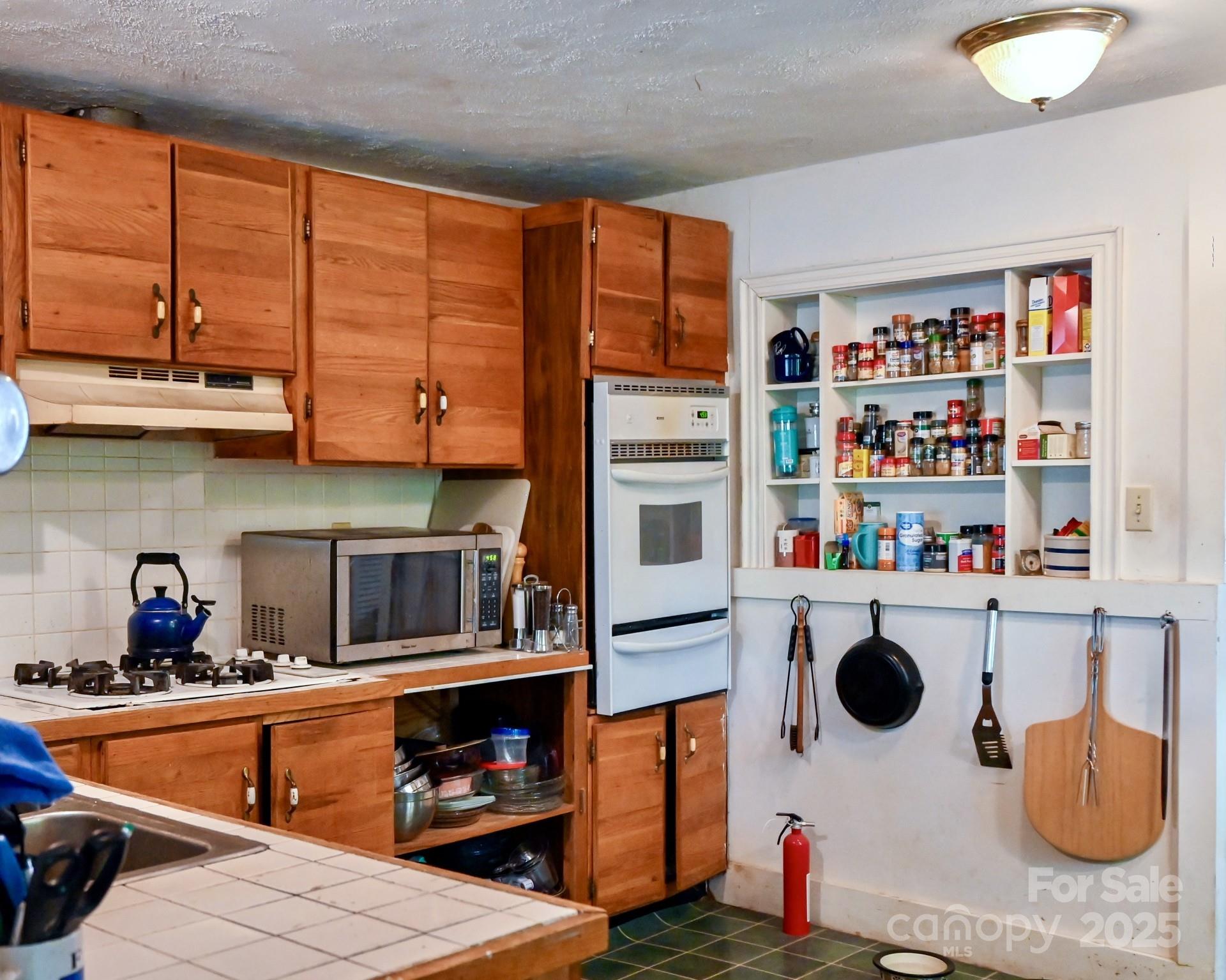 1042 Jackson Road Fort Lawn, SC 29714 - Photo 15 of 17 a kitchen with stainless steel appliances granite countertop a stove and a sink