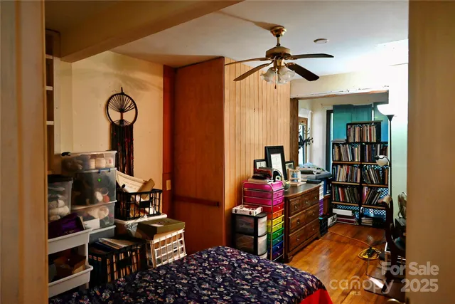 a blue couch sitting next to a window