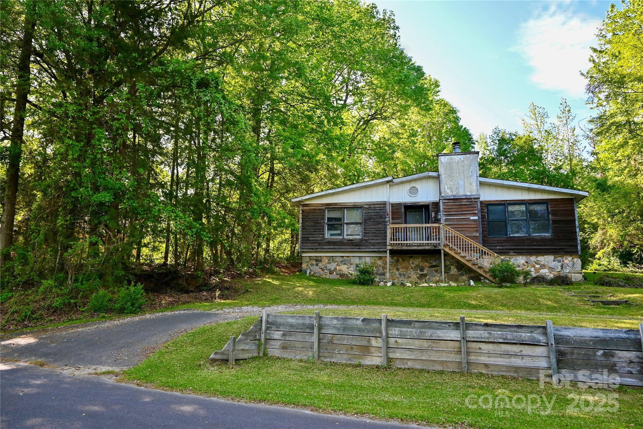 1042 Jackson Road Fort Lawn, SC 29714 - Photo 2 of 17 a front view of a house with garden