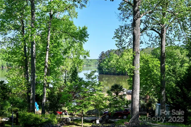 an aerial view of a houses with a yard