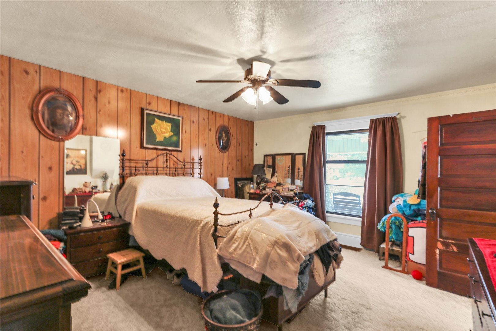 202 East Sherman Street St. Joseph, IL 61873 - Photo 12 of 24 a bedroom with bed and a chandelier