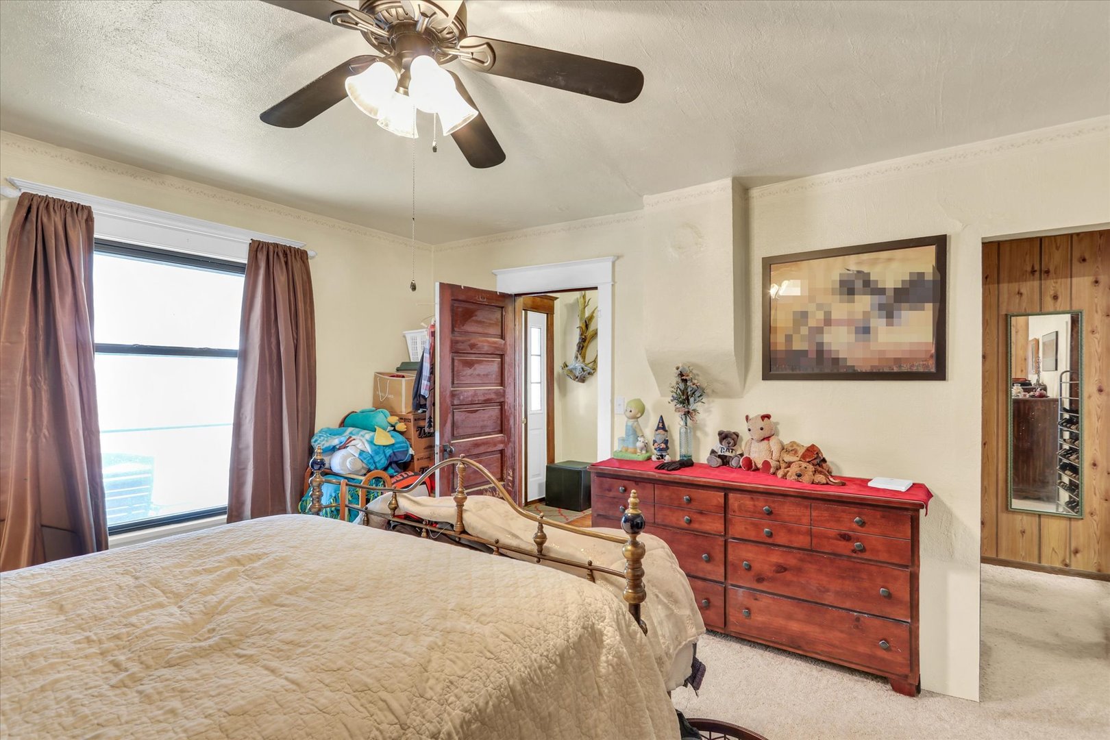 202 East Sherman Street St. Joseph, IL 61873 - Photo 13 of 24 a bedroom with a bed table and a window