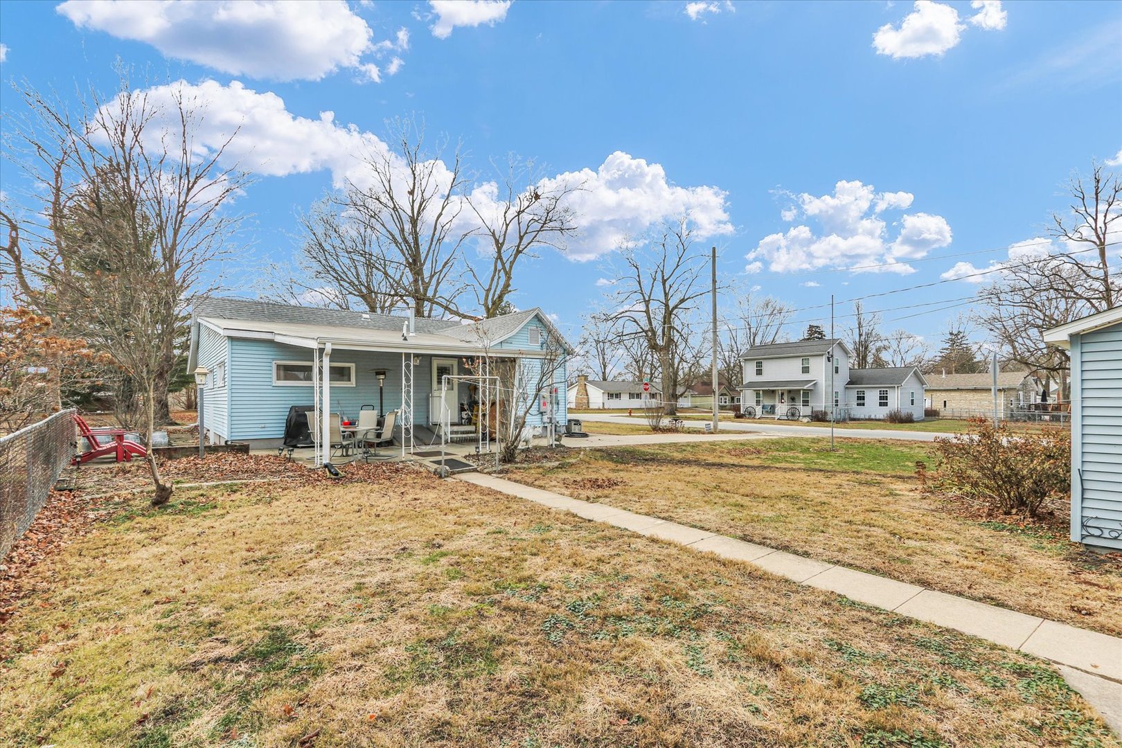 202 East Sherman Street St. Joseph, IL 61873 - Photo 23 of 24 a view of a house with a yard and sitting area