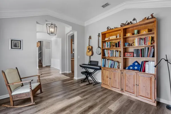 a living room filled with furniture and a large window