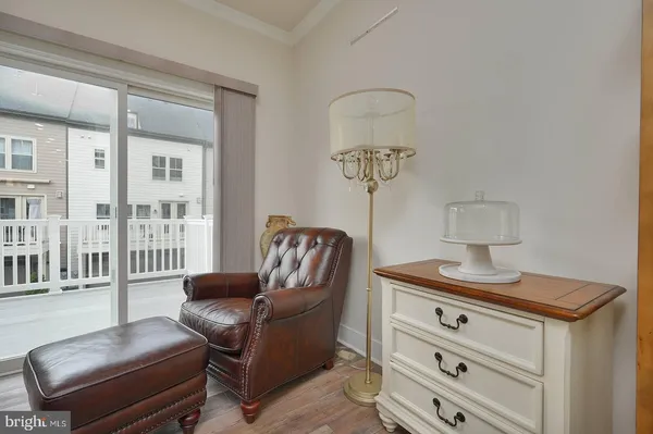 a view of kitchen dining table chairs and wooden floor