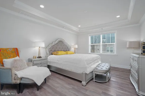 a bedroom with bed and window