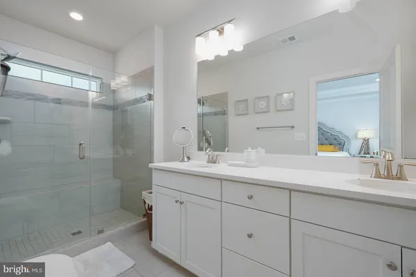 a bathroom with a shower and a sink