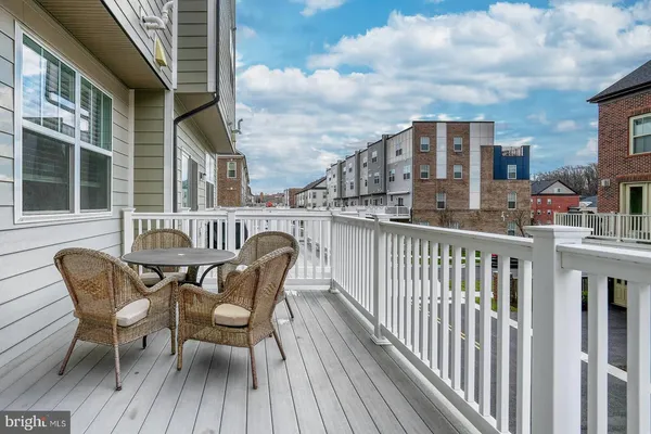 a view of a chair and table in the balcony