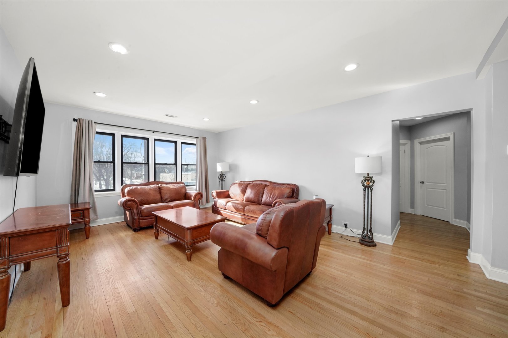 2022 West 95th Street Chicago, IL 60643 - Photo 11 of 21 a living room with furniture and a flat screen tv