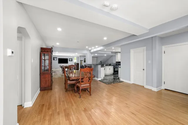a white toilet sitting next to a bathroom sink