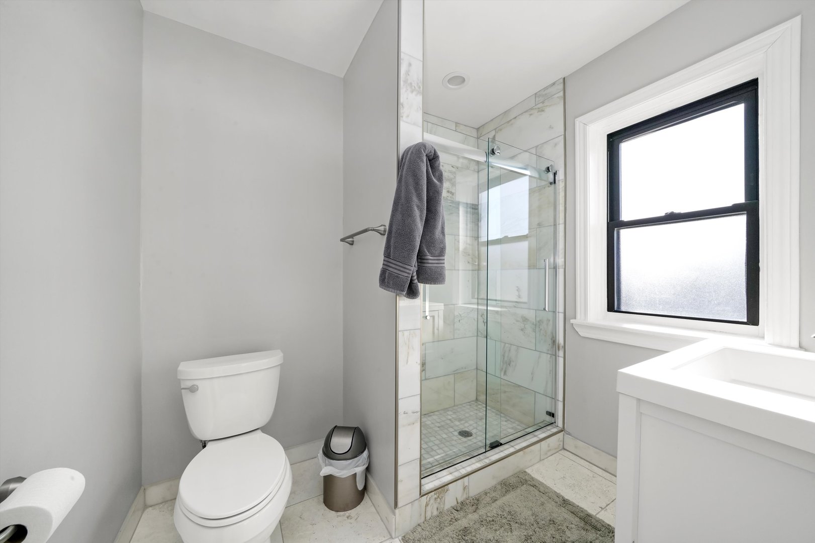 2022 West 95th Street Chicago, IL 60643 - Photo 14 of 21 a white toilet sitting next to a bathroom sink