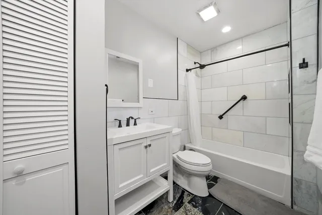 a kitchen with a stove a sink and a refrigerator