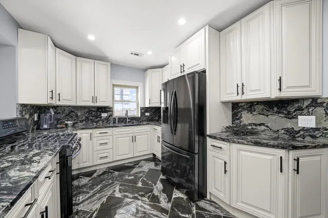 a bathroom with a sink and a window