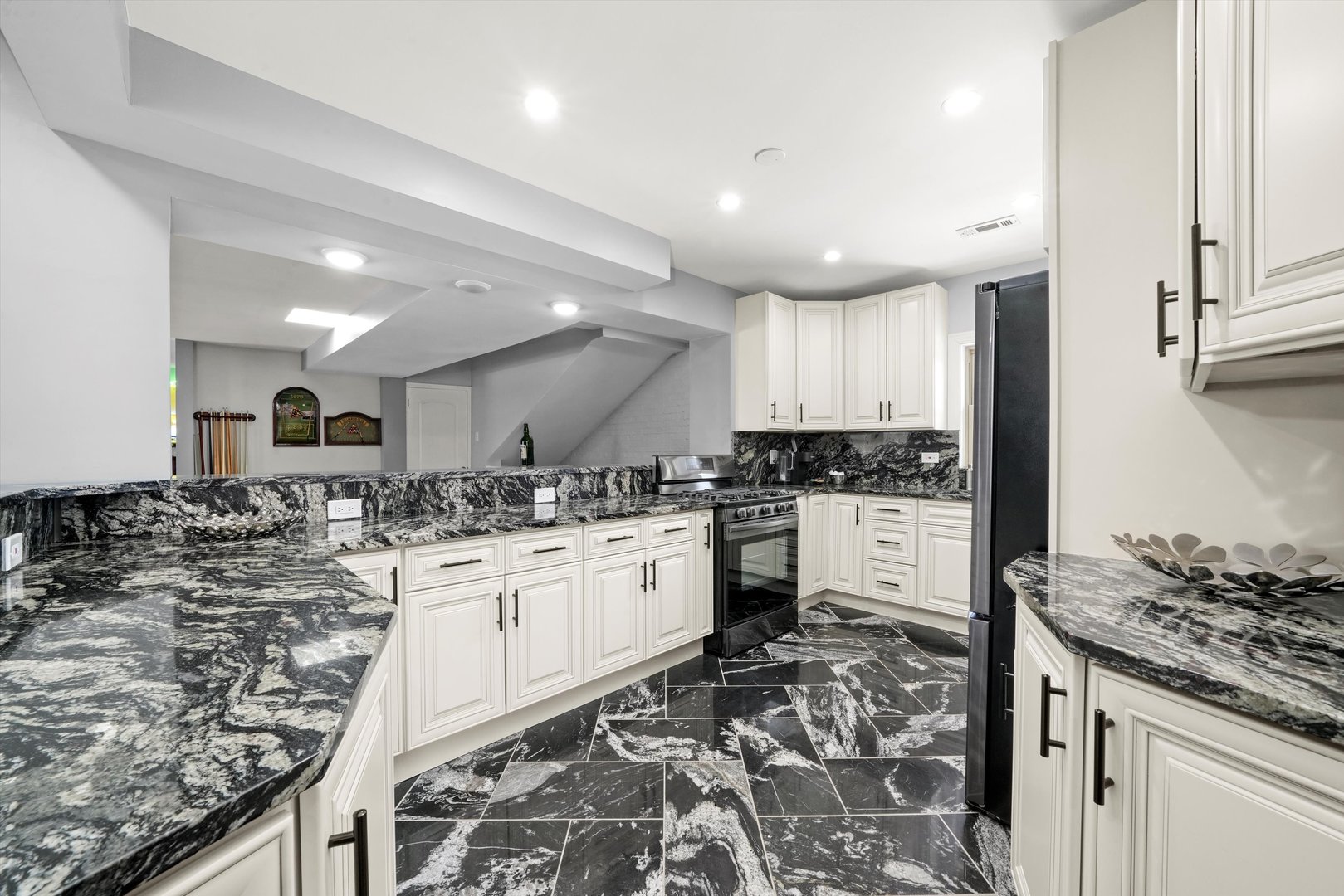 2022 West 95th Street Chicago, IL 60643 - Photo 17 of 21 a kitchen with a stove a sink and a refrigerator