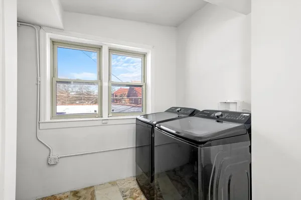 a bedroom with a bed and a table