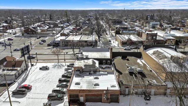an aerial view of residential houses with outdoor space