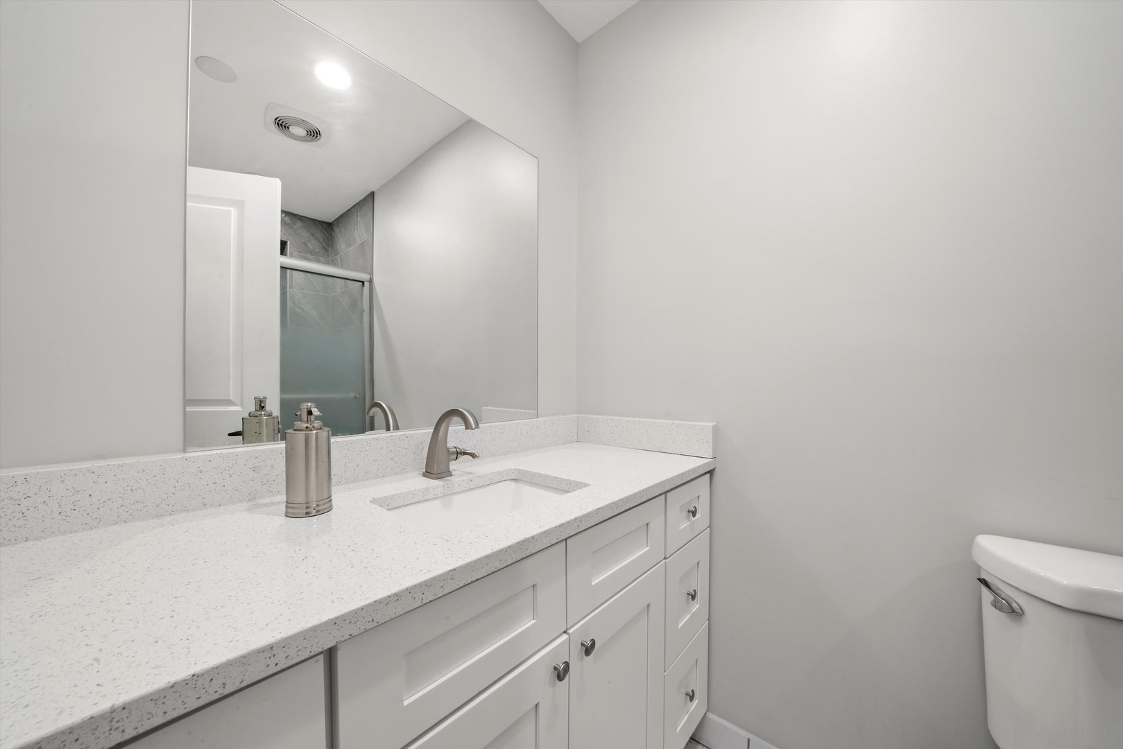 2022 West 95th Street Chicago, IL 60643 - Photo 9 of 21 a bathroom with a sink and a mirror