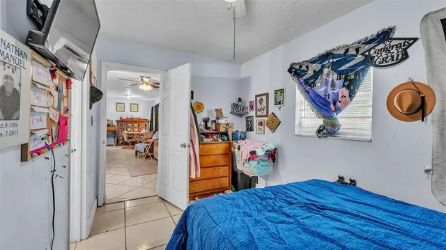 a view of a hallway with entryway and furniture