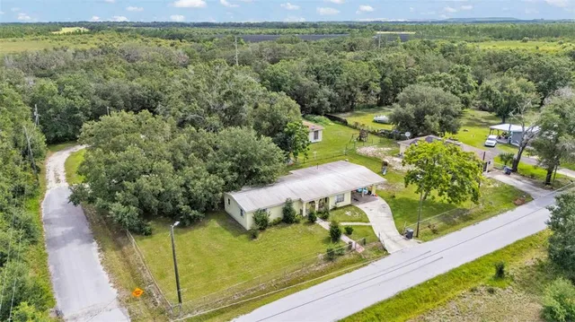 a view of a garden with an outdoor seating area