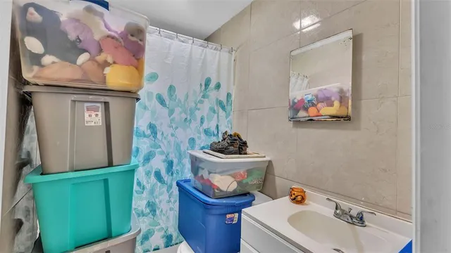 a bedroom with two beds and a flat screen tv