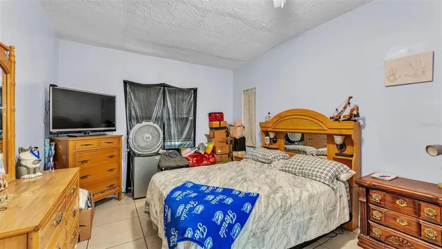 a bedroom with a bed and a closet