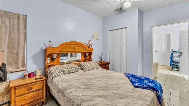 a bed room with a bed and a book shelf