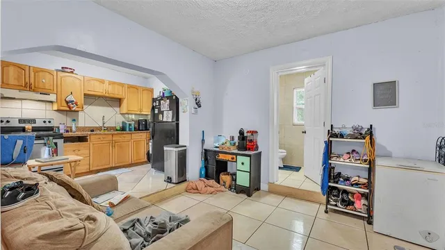 a bedroom with furniture and a window
