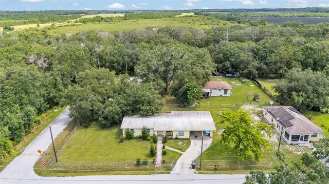 a view of a yard with table and chairs